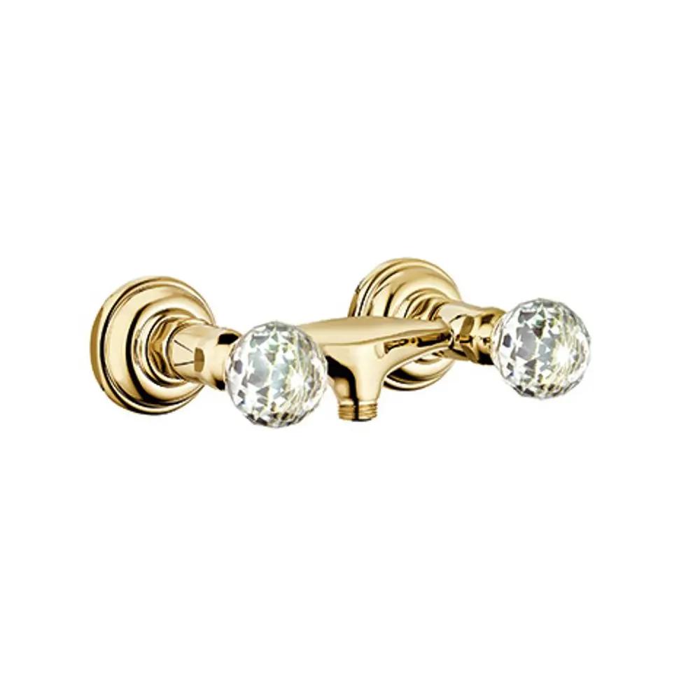 Brausearmatur von Kludi mit Wandmontage, ausgestattet mit zwei transparenten Kristallknöpfen und goldener Oberfläche, geeignet für Badezimmeranwendungen.